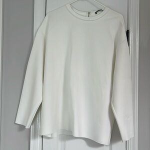 Zara White top. Zipper along the back. Never worn size Small